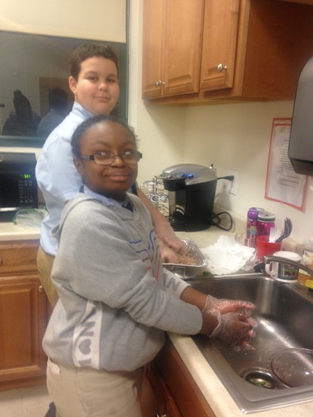 Joseph and Darline prepare cuisine.
